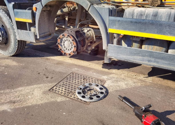 changing wheel on truck with pneumatic wrench